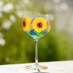 Lynsey Johnstone Hand Painted Sunflowers & Blue Wildflowers Gin Glass | New In -Campus Gifts Sales lesser pavey lp49746 lynsey johnstone sunflowers blue wildflowers gin glass lifestyle